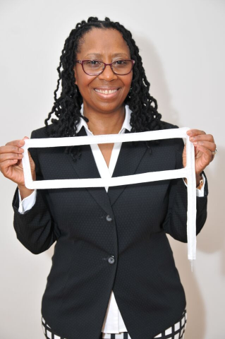 Colleen John, R.N. — Co-founder of RashEndZ, caring for an infant in the NICU
